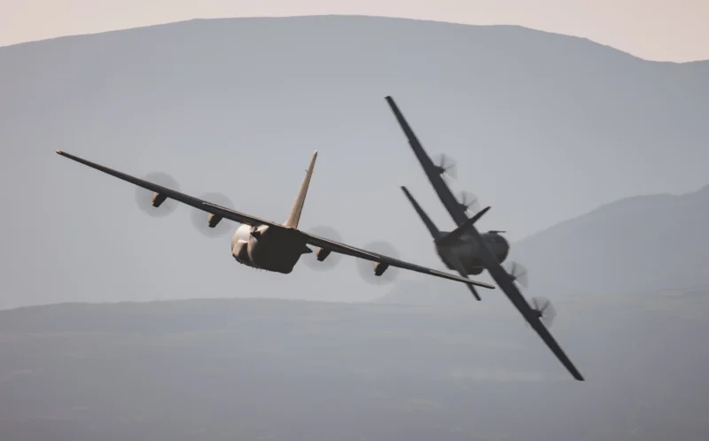 Two RAF C 130 Hercules flying in formation