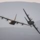 Two RAF C-130 Hercules flying in formation