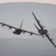 Two RAF C 130 Hercules flying in formation