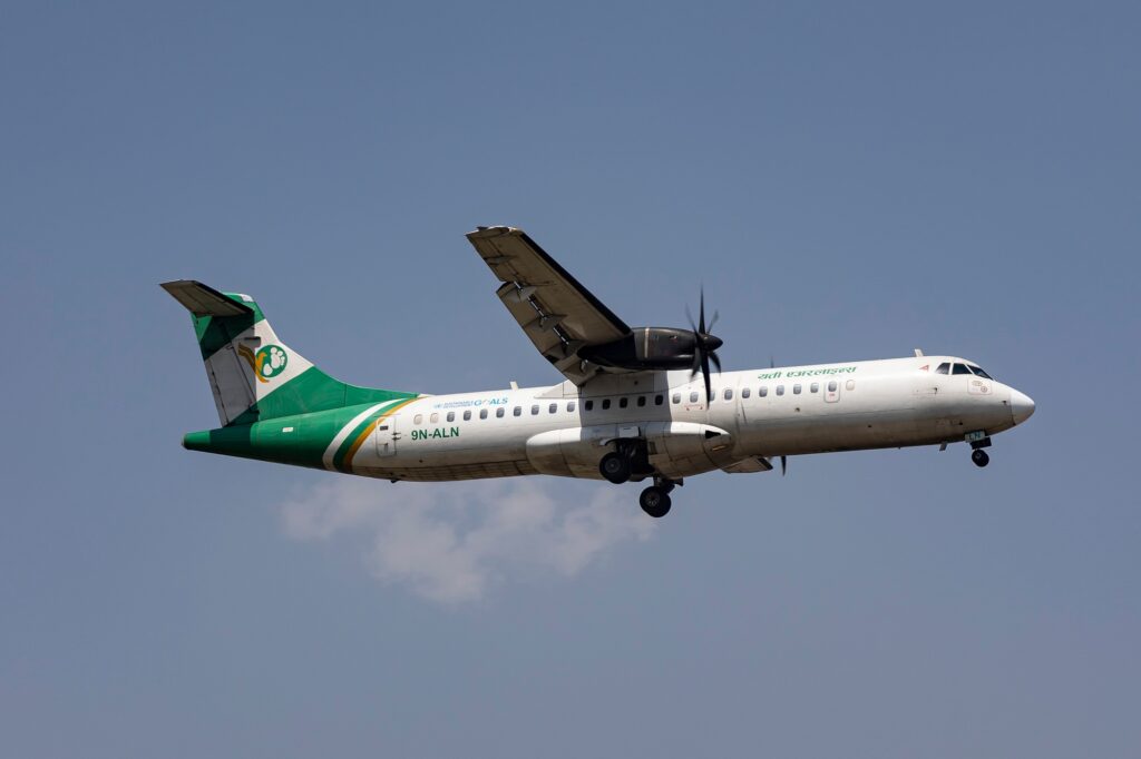 Yeti Airways ATR 72 500 turboprop aircraft flying through the air