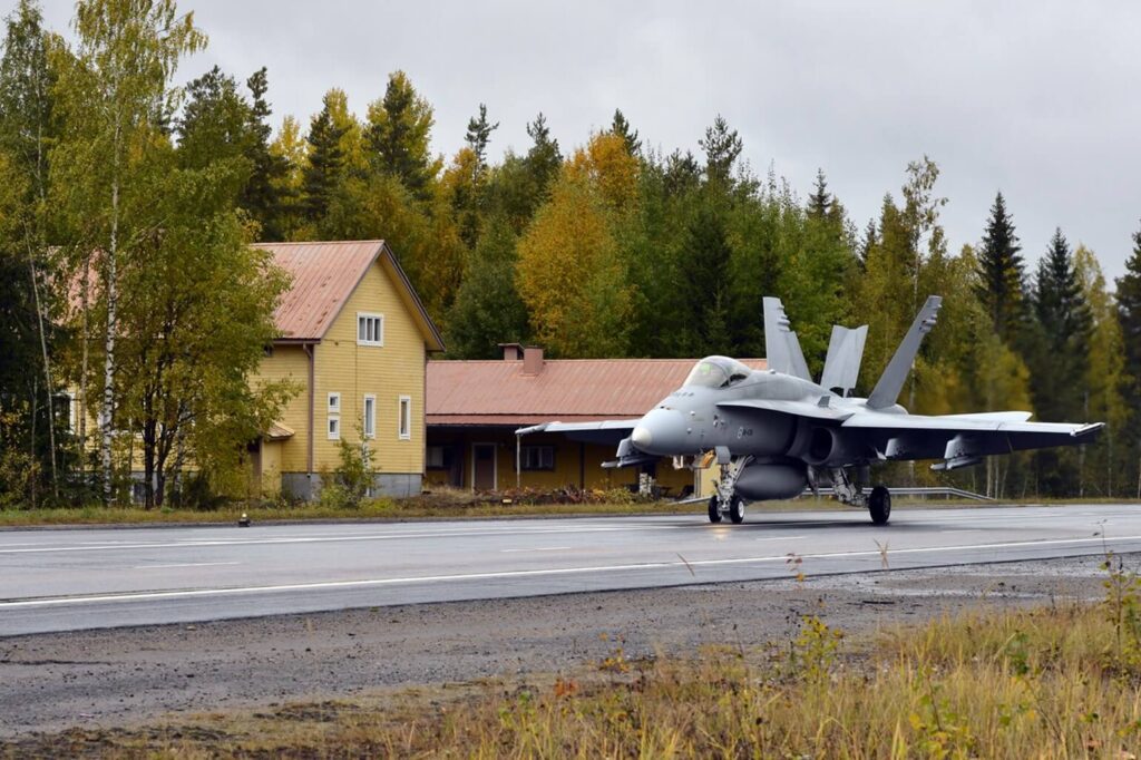 a_finnish_hornet_on_a_highway_next_to_a_house.jpg