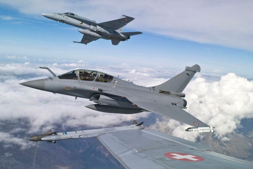 a french rafale in formation with two swiss hornetsjpg a_french_rafale_in_formation_with_two_swiss_hornets.jpg