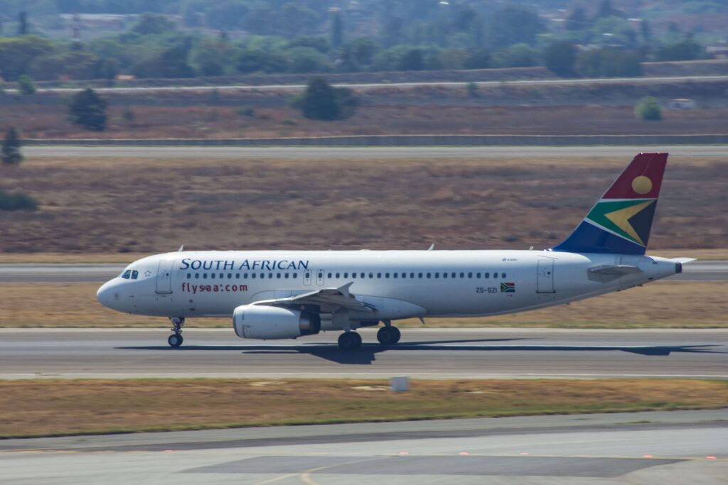 a_south_african_airways_jumbo_jet_taxiing_and_waiting_to_take_off_from_the_o.r._tambo_international_airport_johannesburg..jpg