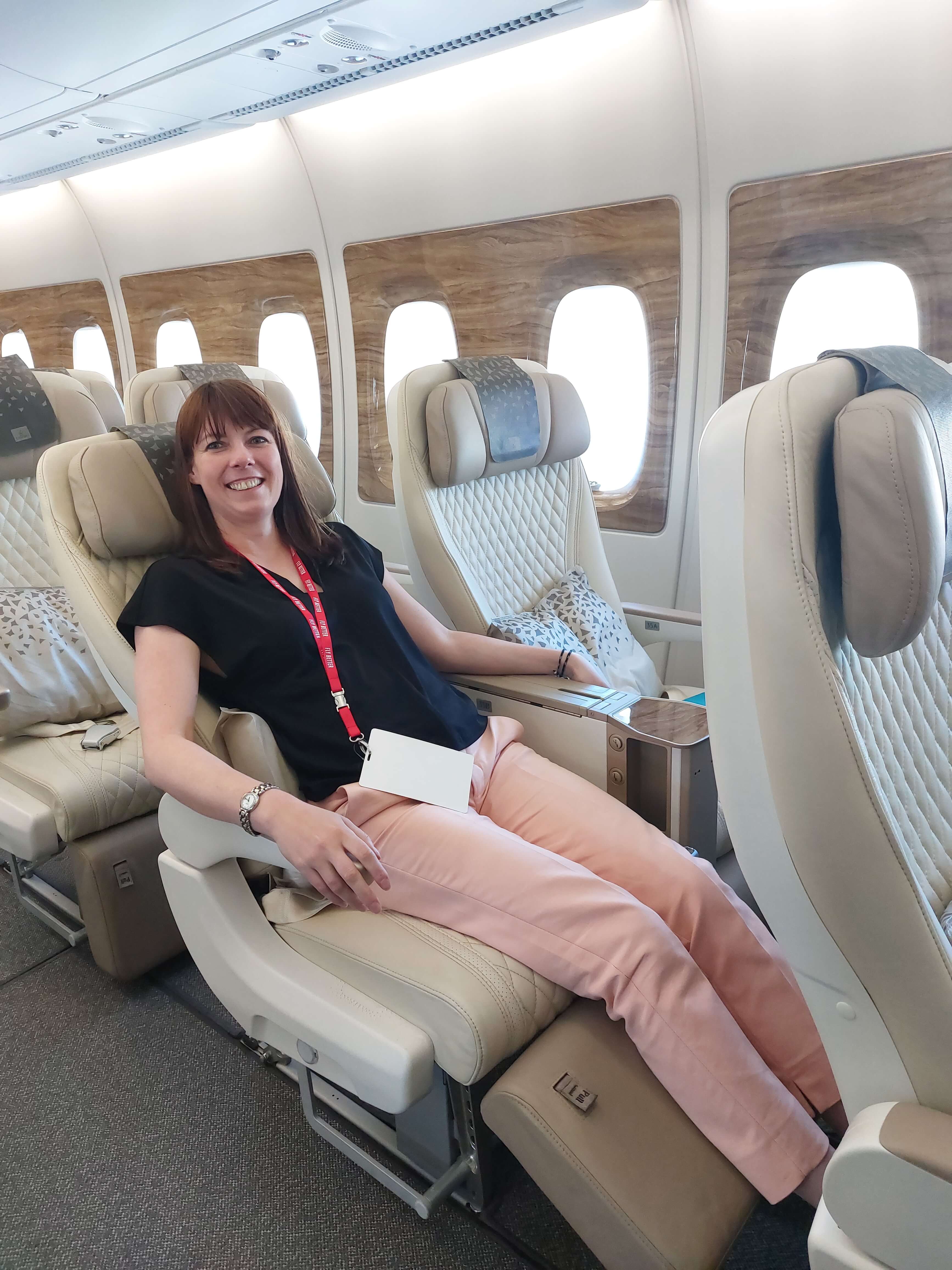 AeroTime reporter in an Emirates A380 premium economy cabin
