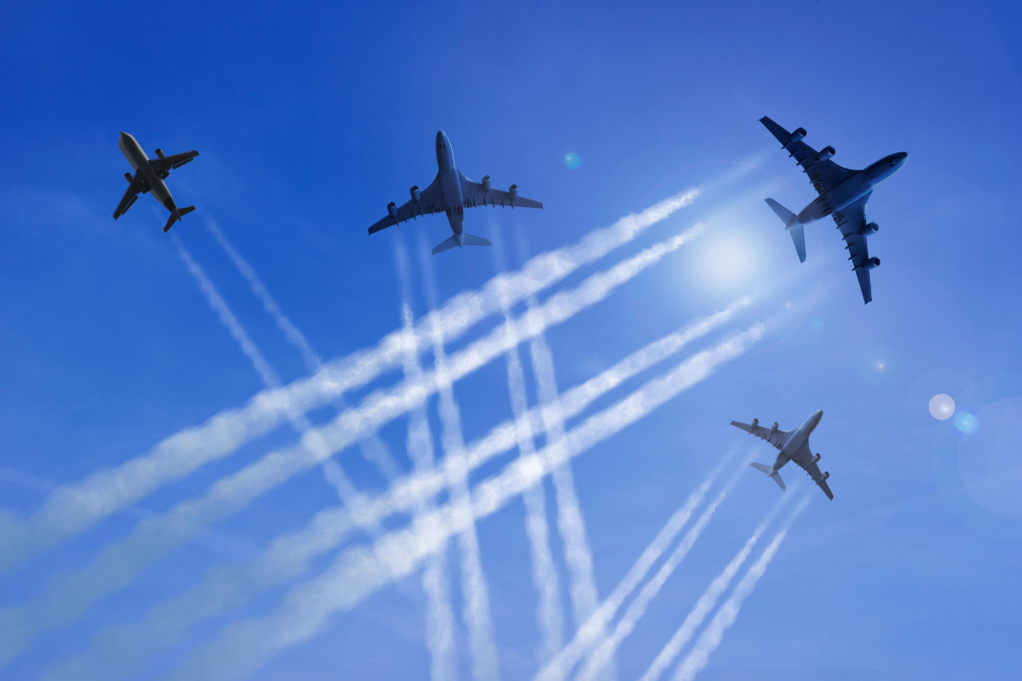 aircraft_and_contrails_against_a_blue_sky.jpg