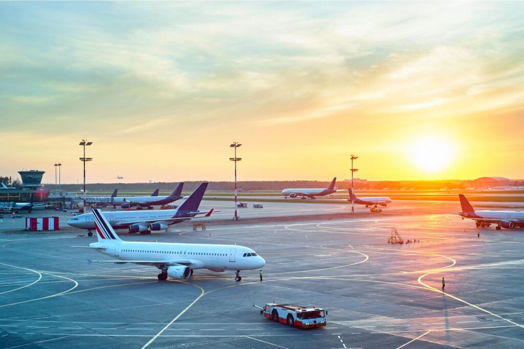 airport_with_many_airplanes_at_beautiful_sunset.jpg