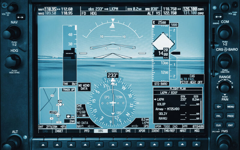 Computer in cockpit. Airplane glass cockpit display with weather radar and engine gauges in small private airplane