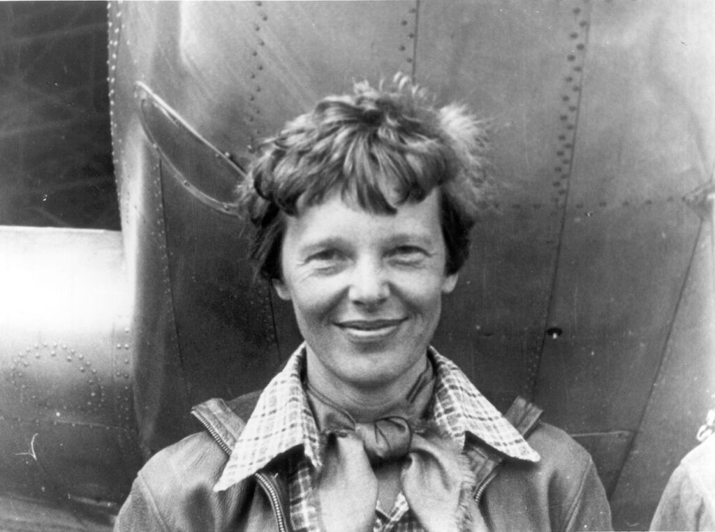 amelia_earhart_standing_under_nose_of_her_lockheed_model_10-e_electra_small.jpg