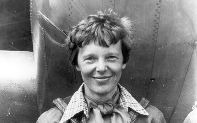 amelia_earhart_standing_under_nose_of_her_lockheed_model_10-e_electra_small.jpg
