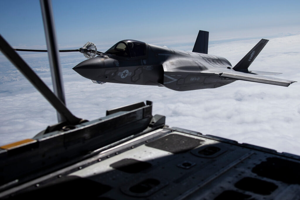 an_f-35b_lightning_ii_attack_jet_flies_alongside_a_kc-130j_tanker_aircraft.jpg