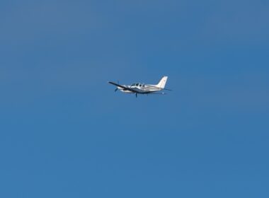 Beechcraft Baron 58 propeller plane leaving from runway