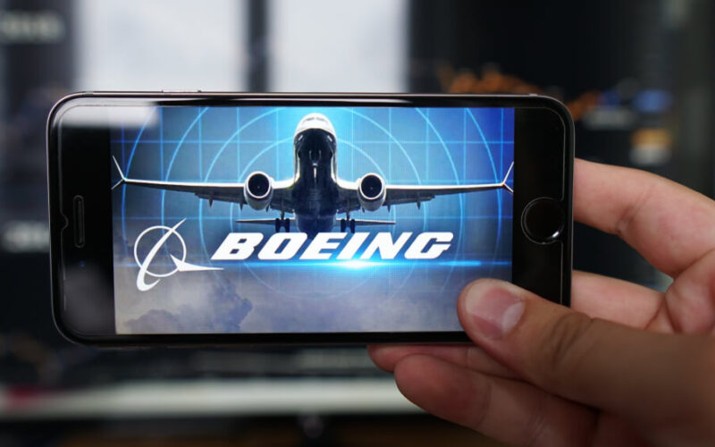boeing_737_max_and_the_companys_logo_displayed_on_a_phone.jpg