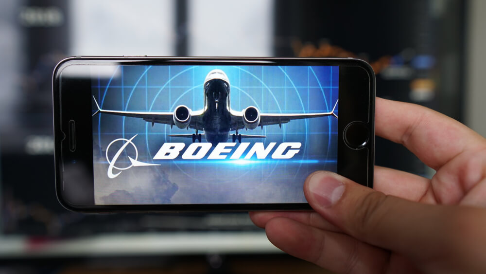 boeing_737_max_and_the_companys_logo_displayed_on_a_phone.jpg