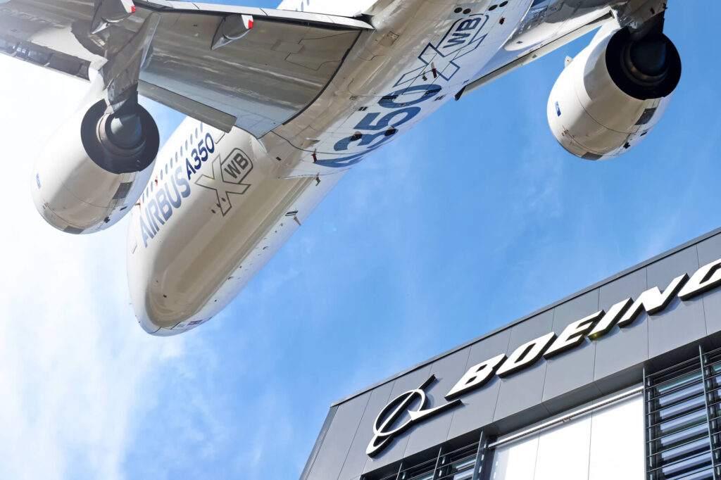 boeing_logo_against_airbus_a350_airplane.jpg