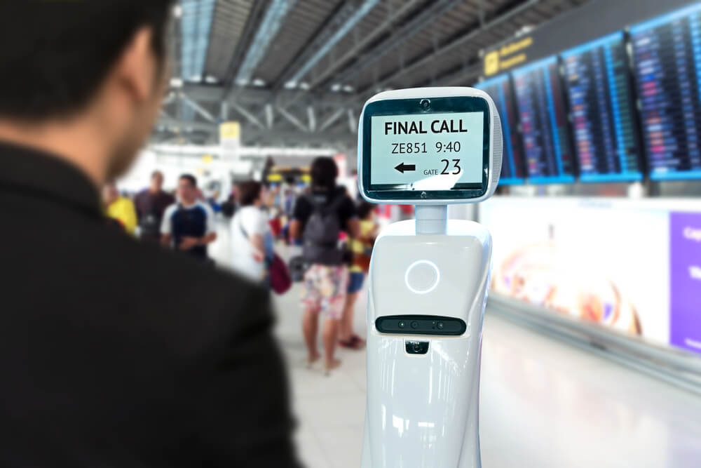businessman_suit_passenger_use_self_driving_chcek-in_robots_assistant_for_ticket_and_accompany_them_to_their_gate_at_international_airport..jpg