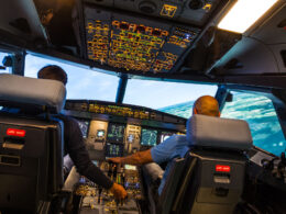 modern airbus airplane cockpit with pilots during a training session in a full flight simulator