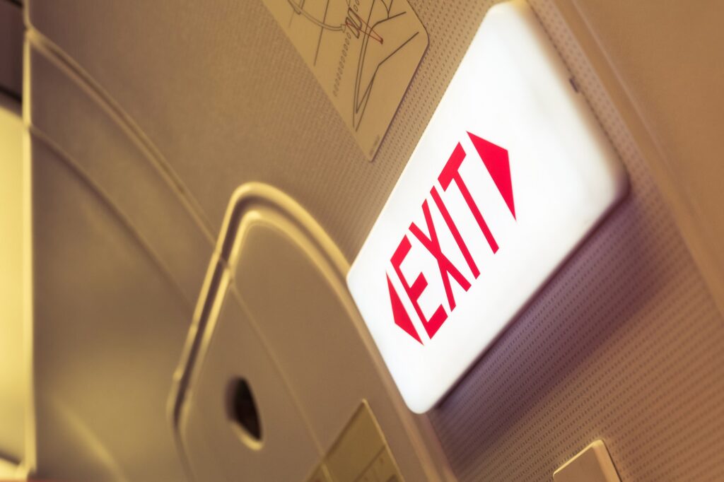 exit sign illuminated so passengers can see the exit clearly