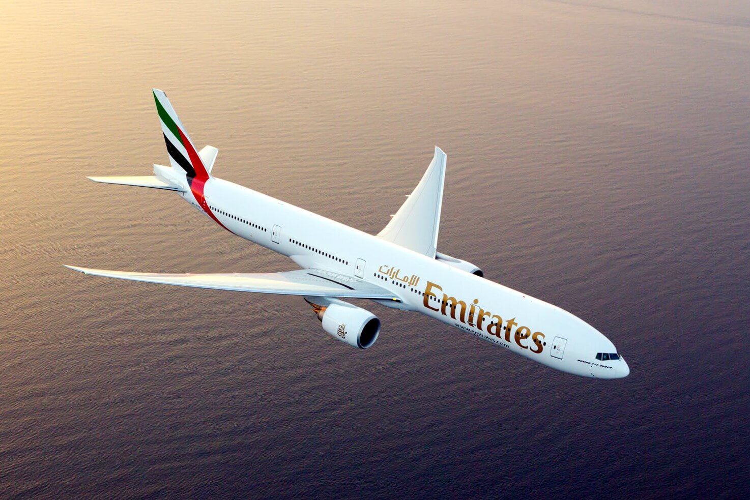 emirates_boeing_777-300er_photographed_on_august_17_2015_from_wolfe_air_aviations_lear_25b..jpg
