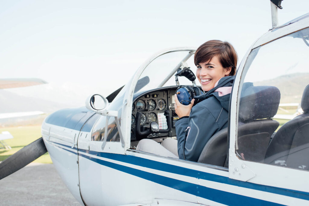 female_trainee_pilot_in_a_small_aircraft.jpg