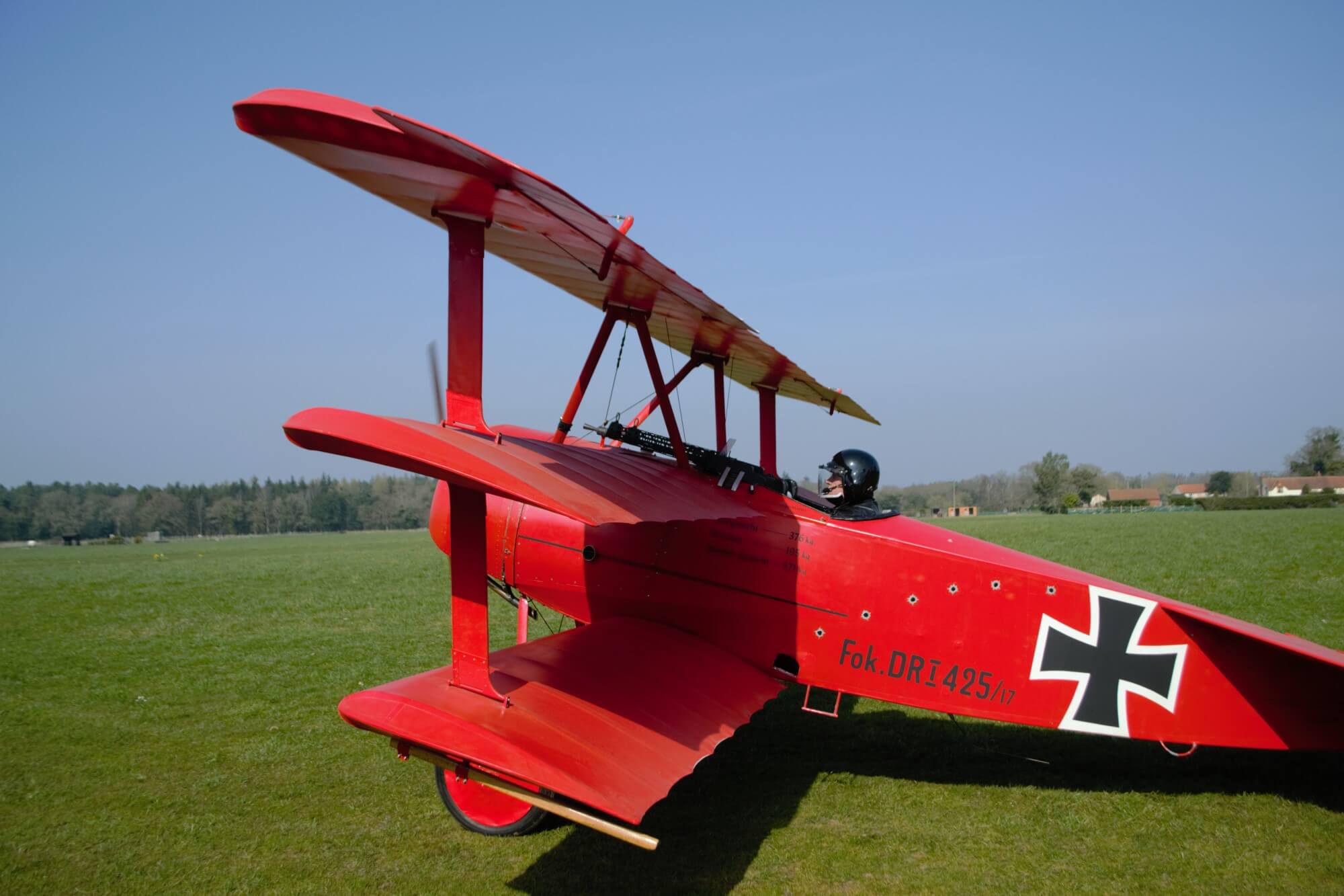 Peter Brueggemann sits in his replica Fokker triplane