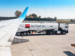 fuel kerosene truck near plane at airport runway
