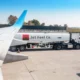 fuel kerosene truck near plane at airport runway