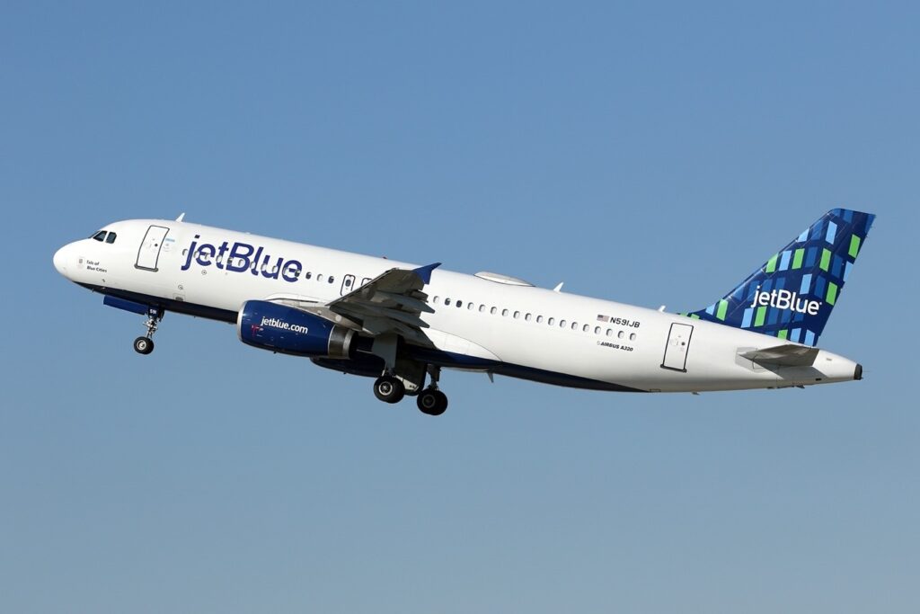 jet blue plane taking off