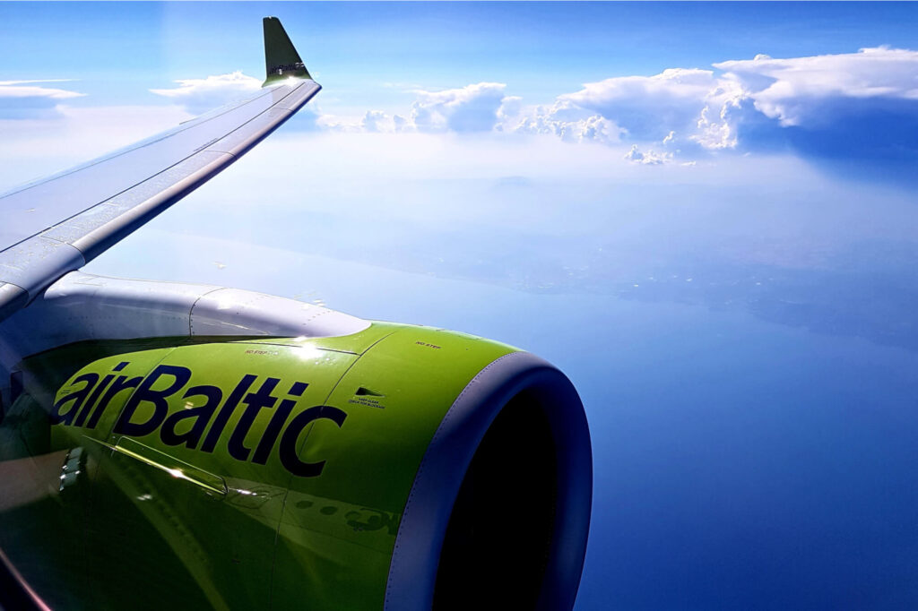 in-flight_view_of_an_airbaltic_wing_and_engine_from_the_passenger_cabin.jpg