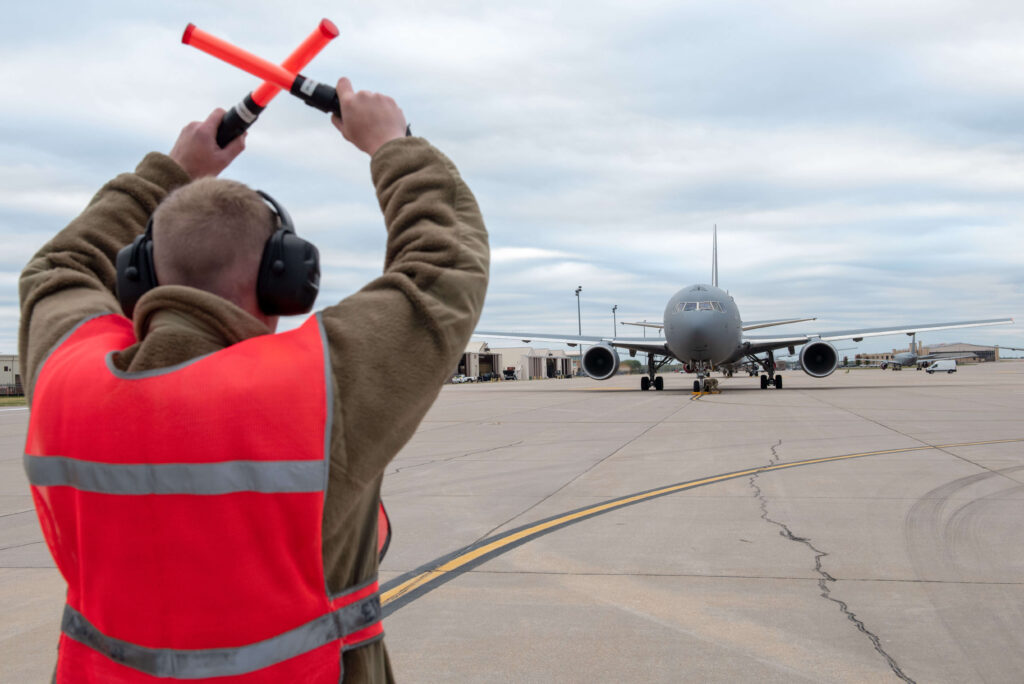 kc-46a_pegasus_tanker_being_marshalled_for_alert_takeoff.jpg