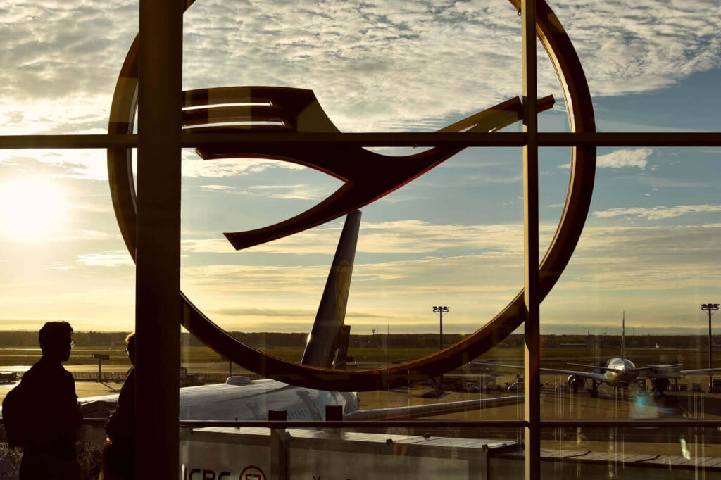 passengers-waiting-under-a-huge-lufthansa-logo.jpg