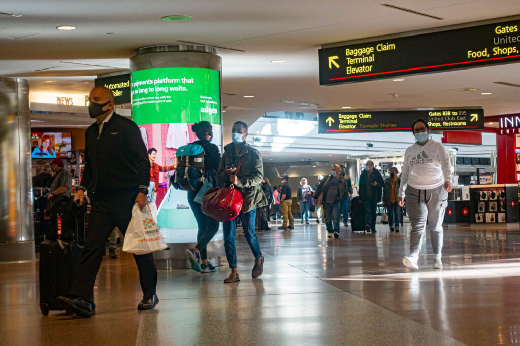 people_wearing_mask_in_denver_international_airport.jpg