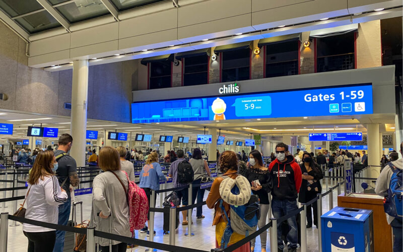 people_wearing_masks_at_a_security_line_at_orlando_international_airport_mco-1.jpg