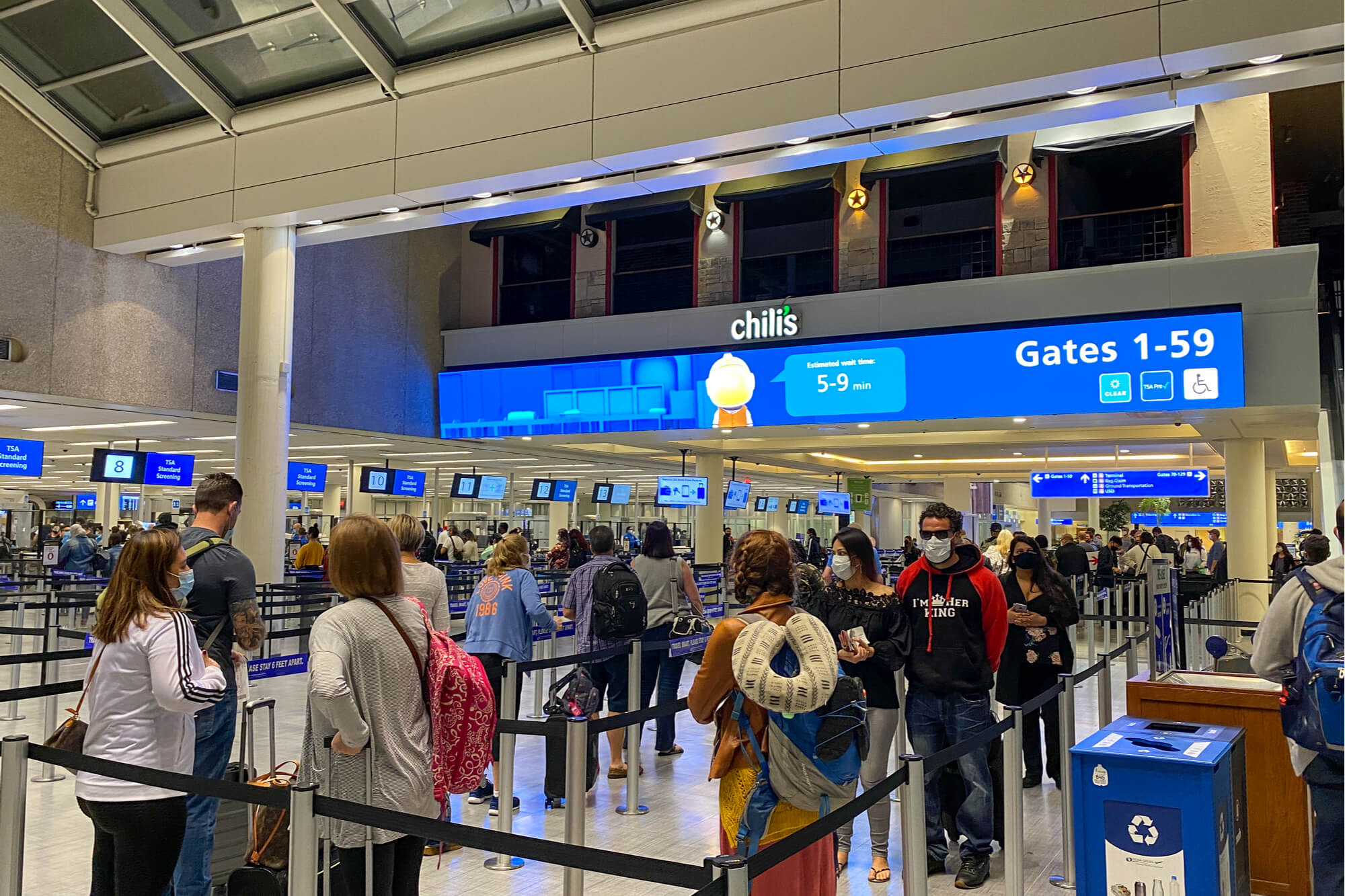 people_wearing_masks_at_a_security_line_at_orlando_international_airport_mco-1.jpg