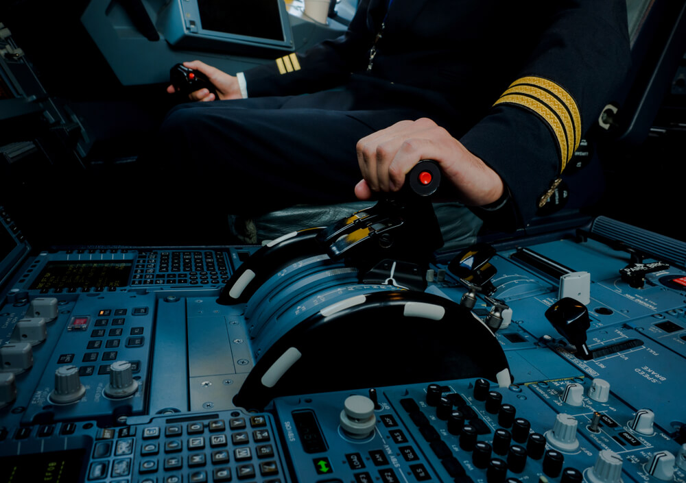 pilot_captain_adjusting_thrust_levels_of_an_aircraft_engine.jpg