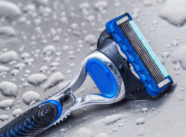 wet disposable razor isolated closeup