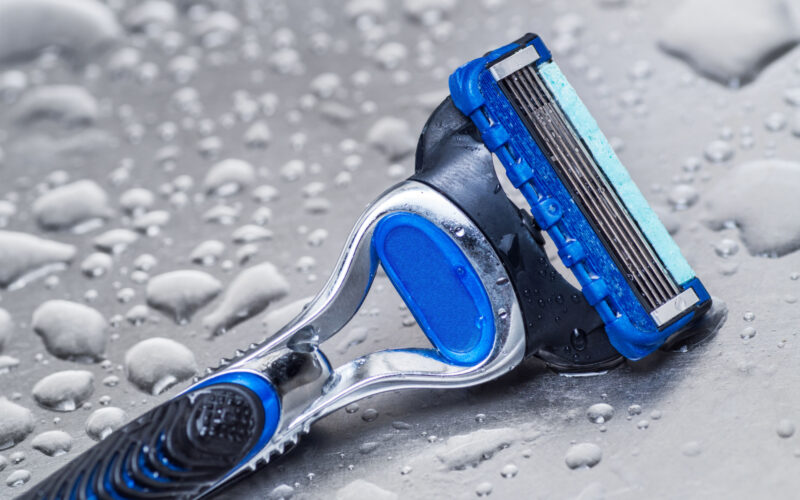 wet disposable razor isolated closeup