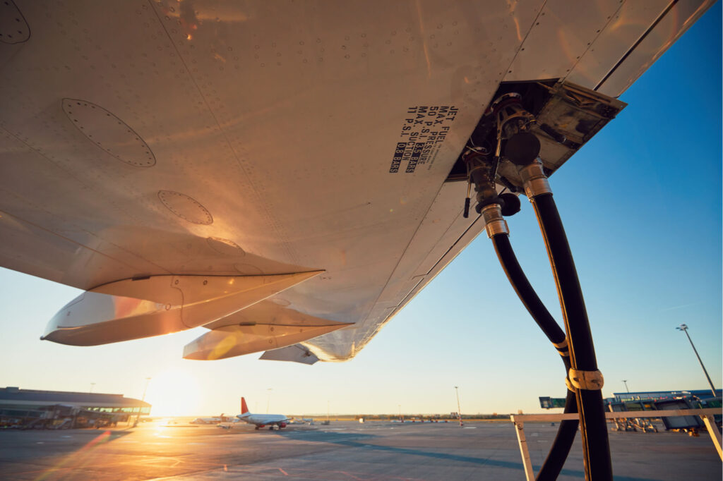 refuelling_of_a_plane_during_sunset.jpg