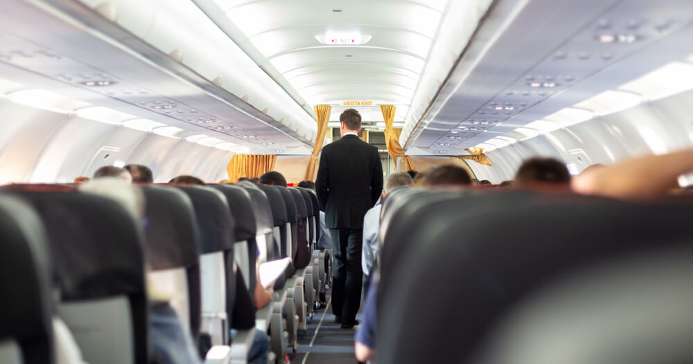 A male flight attendant, an associative photo