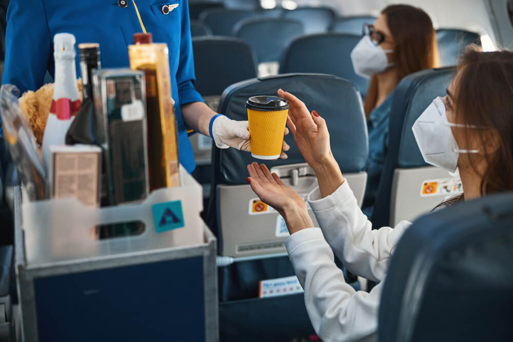 The flight attendant performs passenger service