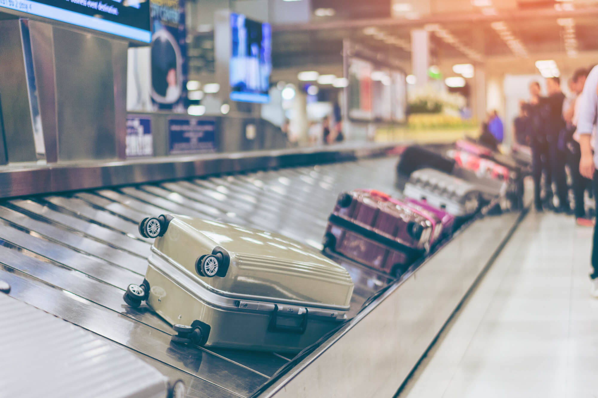 suitcases on an airport baggage belt
