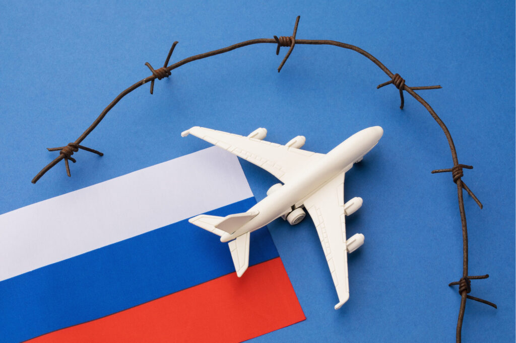 toy_aircraft_with_a_russia_flag_and_barbed_wire.jpg
