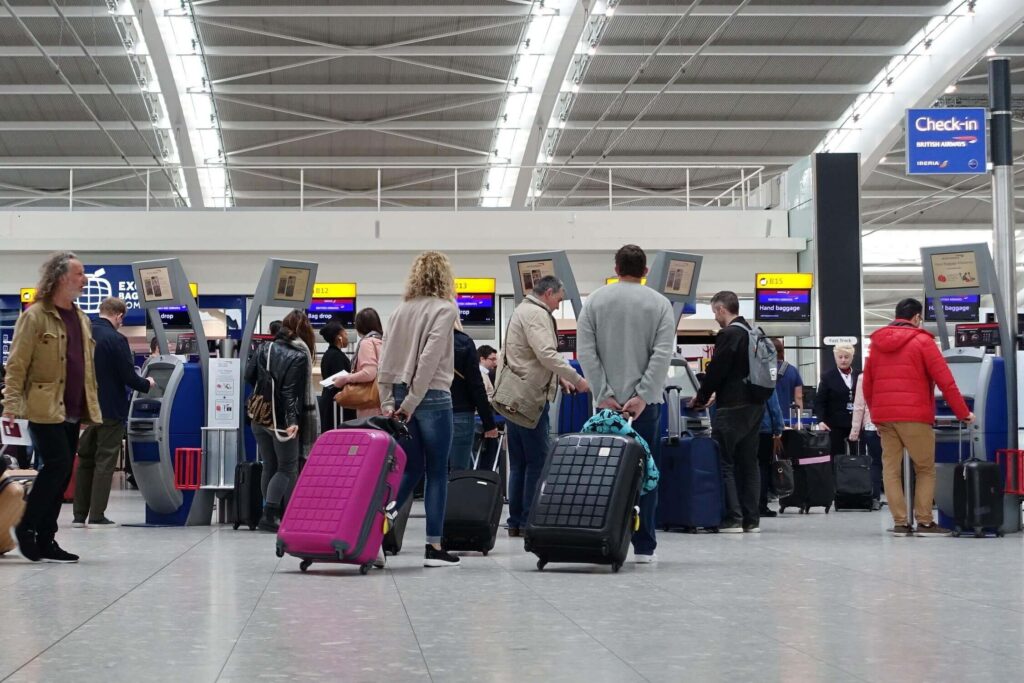 travellers at a check in at heathrow airport 1jpg travellers_at_a_check_in_at_heathrow_airport_1.jpg