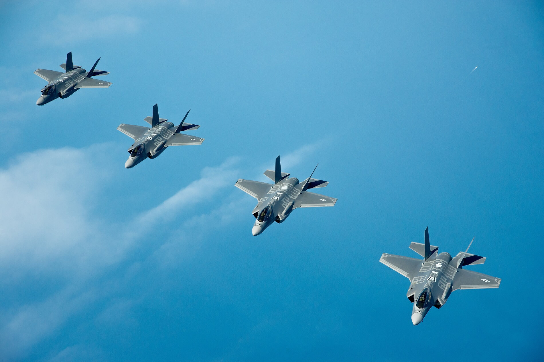 Four USAF F 35A Lightning II fighter jets flying in formation