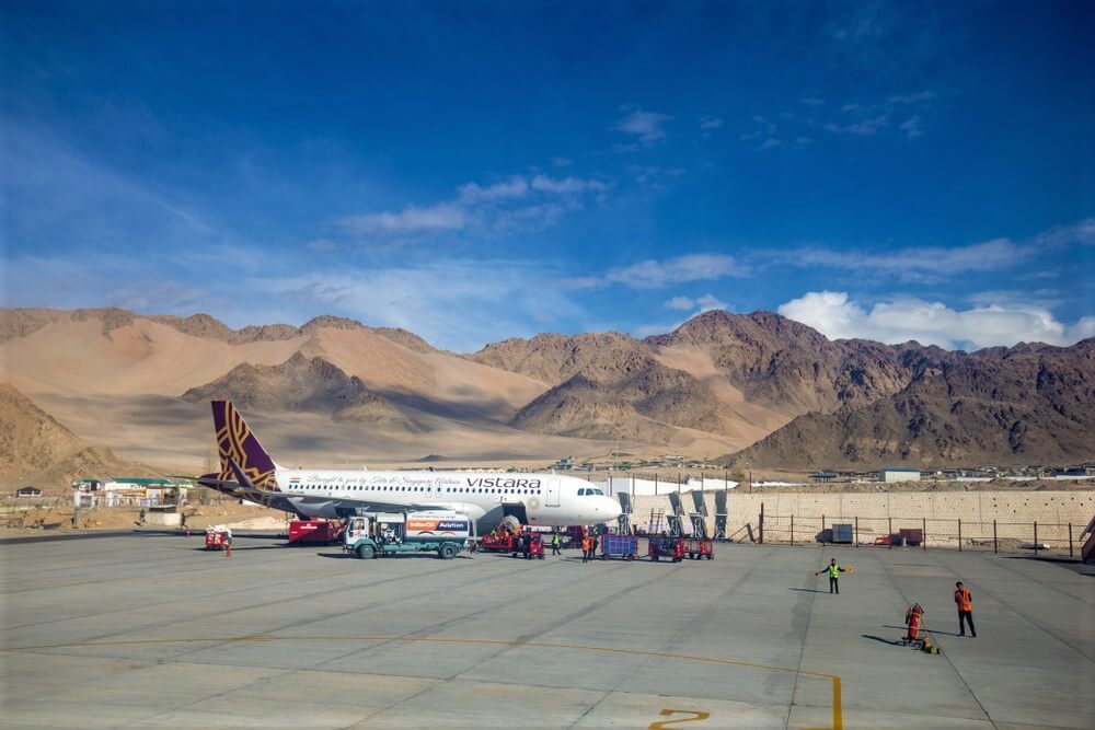 vistara_aviation_airplane_has_been_arrived_in_leh_airport_with_clear_cold_sky_in_himalayan_snow_mountain_background..jpg