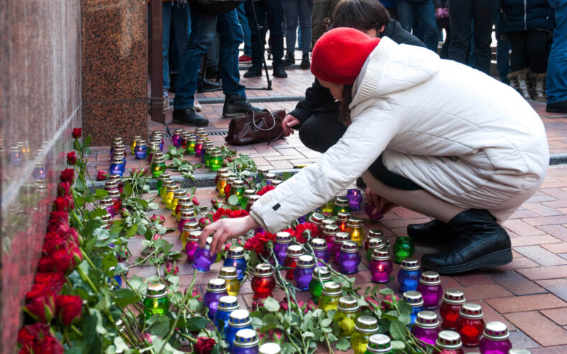 woman_lays_flowers_in_front_of_iranian_embassy_in_ukraine.jpg