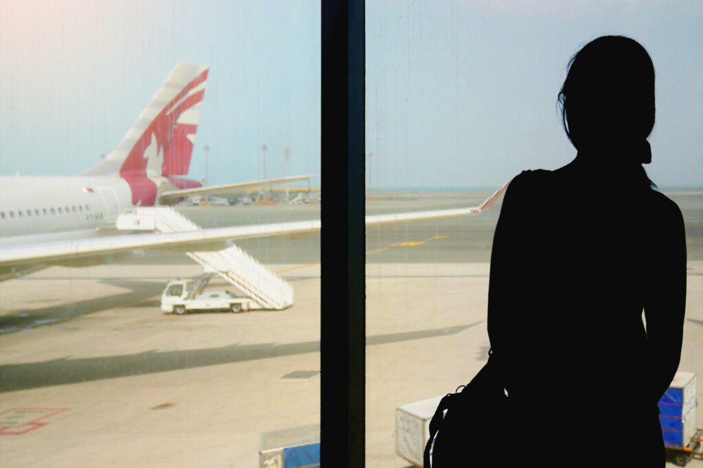 woman_waiting_to_board_in_doha_airport.jpg
